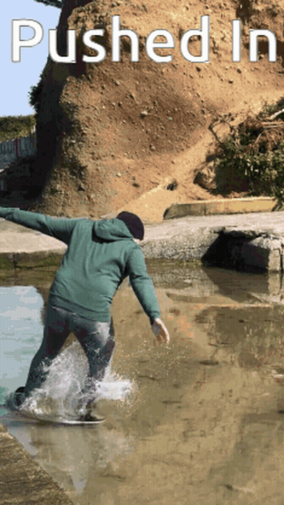 Person Riding Skateboard In Puddle GIF