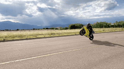 Person Riding Yellow Motorcycle GIF