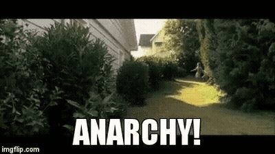 Person Running Down Path With Anarchy GIF