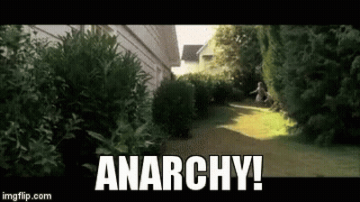 Person Running Down Path With Anarchy GIF