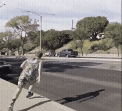 Person Running Down Street With Blue Truck GIF