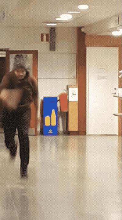 Person Running Past Recycling Sign GIF