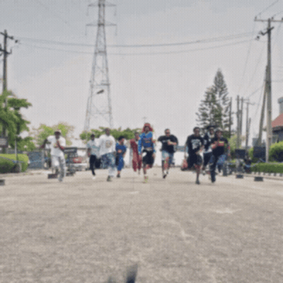 Person Running With Shape Behind GIF