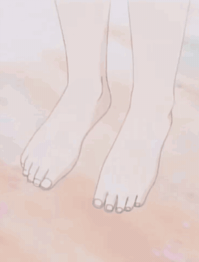 Person's Bare Feet On Sandy Surface GIF