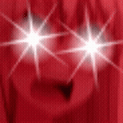Person's Eyes Shining On Red Background GIF