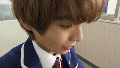 Person's Face Close Up In Blue Suit GIF