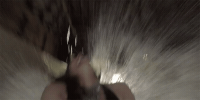 Person's Face Close Up In Waterfall GIF