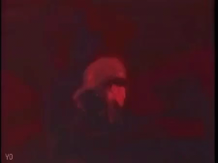 Person's Face In Dark Room With Red Lights GIF