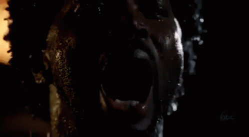 Person's Face In Dark With Mouth Open GIF