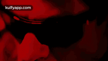 Person's Face In Red Light GIF