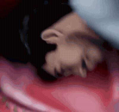 Person's Face Lying On Pink Blanket GIF
