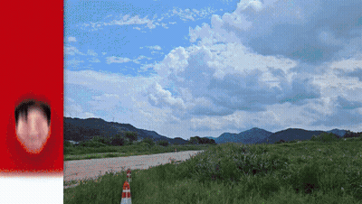 Person's Face Next To Road With Mountains GIF