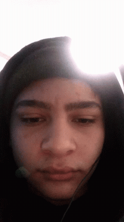 Person's Face Wearing Hooded Jacket GIF