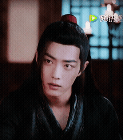 Person's Face With Chinese Writing GIF