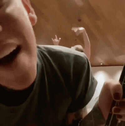 Person's Face With Peace Sign Hand GIF