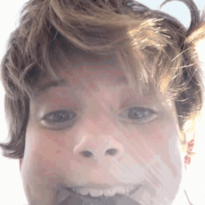 Person's Face With Slight Smile GIF