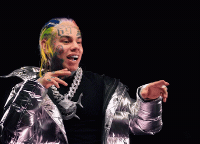 Person's Face With Tattoo Saying Six Nine GIF