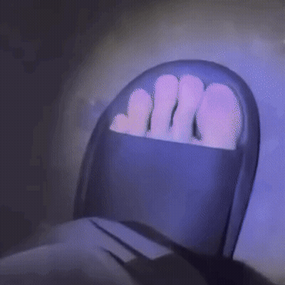 Person's Feet In Purple Chair GIF