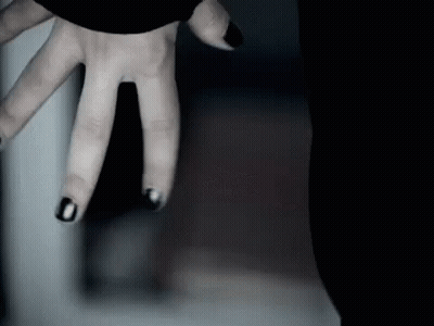 Person's Hand With Black Nail Polish GIF