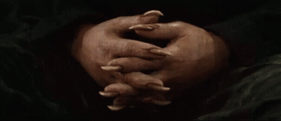 Person's Hands With Long Claws GIF