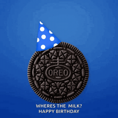 Person Scooping Ice Cream Into Cookie GIF