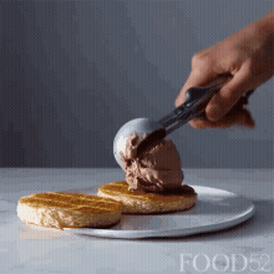 Person Scooping Ice Cream Onto Waffle GIF