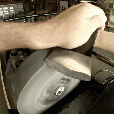 Person Sharpening Knife On Machine Saying Sharpen GIF