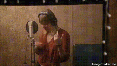 Person Singing Into Microphone GIF