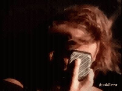 Person Singing Into Microphone Close Up