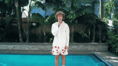 Person Singing Into Microphone GIF