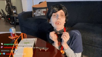 Person Sitting At Table With Let's Make Mistakes Together Pillow GIF