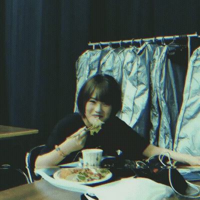 Person Sitting At Table With Plate Of Food GIF