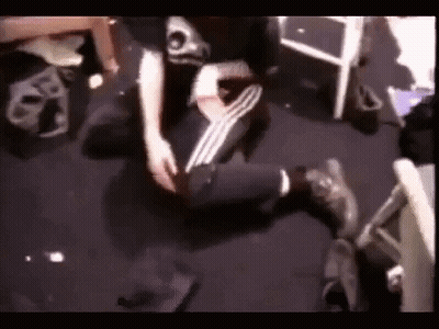 Person Sitting Cross-Legged On Floor GIF