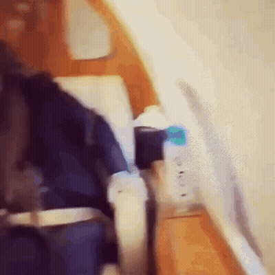 Person Sitting In Airplane With Water Bottle On Armrest GIF