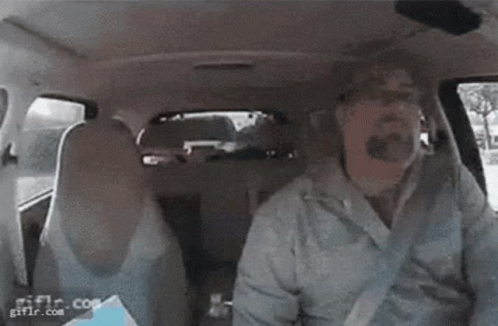 Person Sitting In Back Seat Of Car With Bottle Of Water GIF