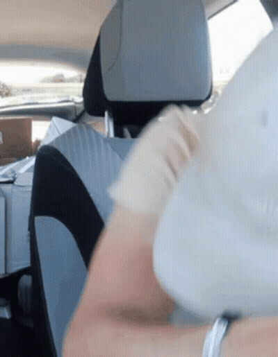 Person Sitting In Car With White Hat GIF