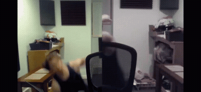 Person Sitting In Chair In Room GIF