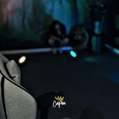 Person Sitting In Chair With Capon Logo GIF