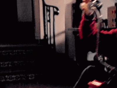 Person Sitting On Chair With Clock On Floor GIF