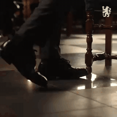 Person Sitting On Chair With Foot On Leg GIF