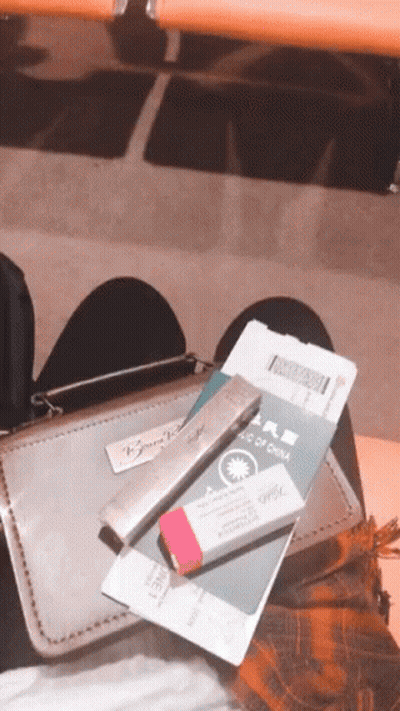 Person Sitting On Chair With Passport And Pencil GIF