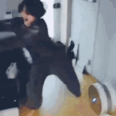 Person Sitting on Chair with Vacuum Cleaner