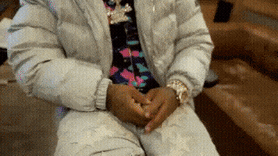 Person Sitting On Couch Hands On Hips GIF