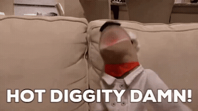 Person Sitting On Couch With Sock In Mouth Saying Hot Diggity Damn GIF