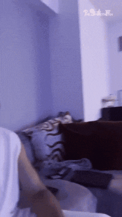 Person Sitting On Couch With The Simpson Family Sign GIF