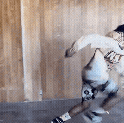 Person Skateboarding In Room With Wooden Wall GIF