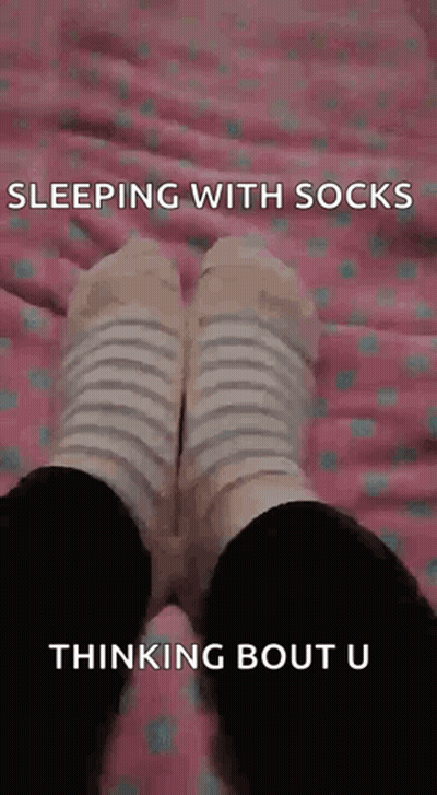 Person Sleeping With Socks Thinking About You GIF