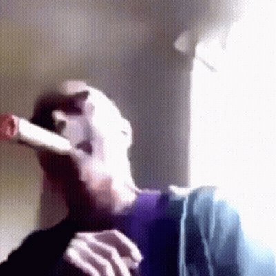 Person Smoking Cigarette By Window GIF