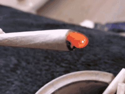 Person Smoking Cigarette With Orange Flame GIF