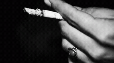 Person Smoking Cigarette With Ring GIF